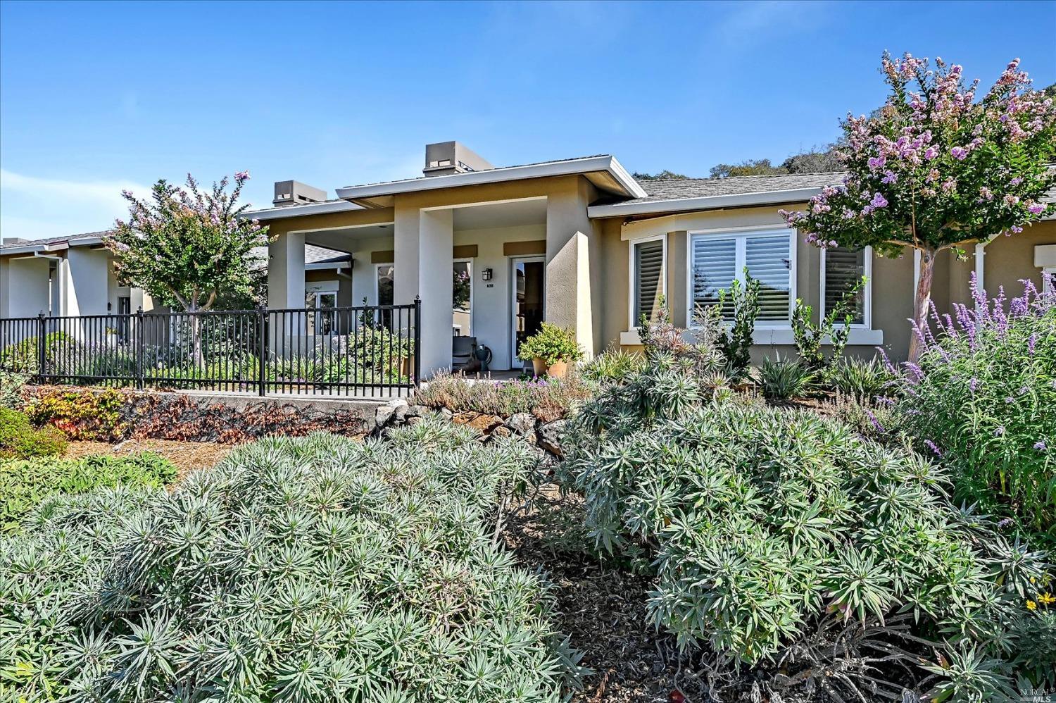 763 Deer Valley Road San Rafael, California Smith Ranch Homes Retirement Community. A rare opportunity to view this modern Villa with trendsetting cutting-edge design offers style & convenience boasting a private entrance with two bedrooms,two baths, a spacious kitchen with adjoining office space, and an attached garage. The entry, living room/dining & kitchen have new custom plank oak hardwood floors. The gracious living room has 10' high ceilings w/an Ortal gas fireplace. Custom cabinets provide space to display your books and collections. Pendant lights by Foscarini accentuate the dining area. French doors lead to a covered private patio overlooking the campus. Custom cabinetry throughout combines a modern mix of wood, laminate, glass,and resin. The kitchen's custom cabinetry conceals a Thermador refrigerator/Bosch dishwasher & a Thermador gas cooktop. The adjoining office space is wired to support a full complement of office equipment. The primary bedroom includes a wall mounted Rimadesio cabinet, plantation shutters with a customized spacious walk-in closet. The bath boasts all new fixtures, Snaidero cabinetry, stone and Porcelanosa sculptural relief tiles in the walk-in shower. A separate laundry room has Miele washer/dryer which is raised for easy access. Garage has storage & battery storage walls.