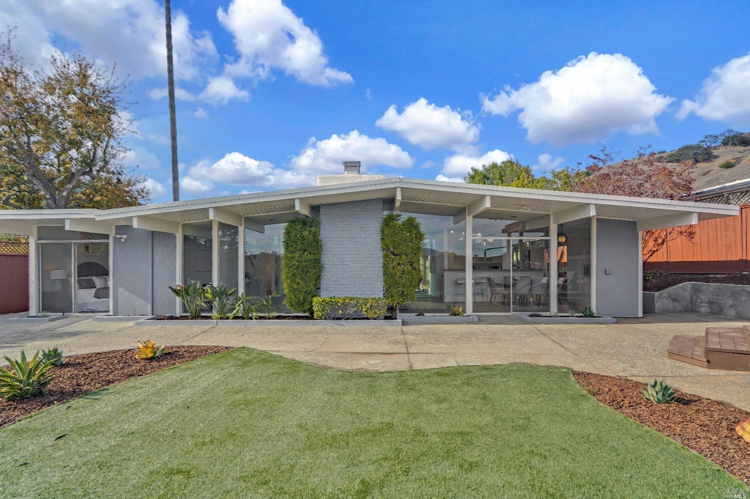 Gorgeous remodeled Eichler in the sought after Miller Creek School District! Eichler enthusiasts must see this home. While most Eichlers only have about 1,700 sq. ft of living space, this truly special Eichler has approx.2,200 sq ft, after converting the light filled atrium into a heated and air conditioned living space, with skylights that open, making this a truly unique and spacious home and a great value for a discerning buyer. New electrical, plumbing, lights, appliances, sink, flooring, baseboards, trim, paint in kitchen area plus new kitchen cabinets with Kovastone quartz counters. New tiles, fixtures, lights, vanities, quartz countertops, electrical and plumbing in bathrooms. New shower enclosure in primary bath. New luxury vinyl flooring throughout the house, the insulated foam roof has recently been recoated and the interior and exterior are freshly painted. Two enclosed garage spaces with new epoxy floors and lots of storage. Convenient to hiking and biking trails, plus all the amenities that Terra Linda has to offer including Santa Margarita Park and the Terra Linda Community Center and Pool. This is truly the Eichler you've been waiting for!