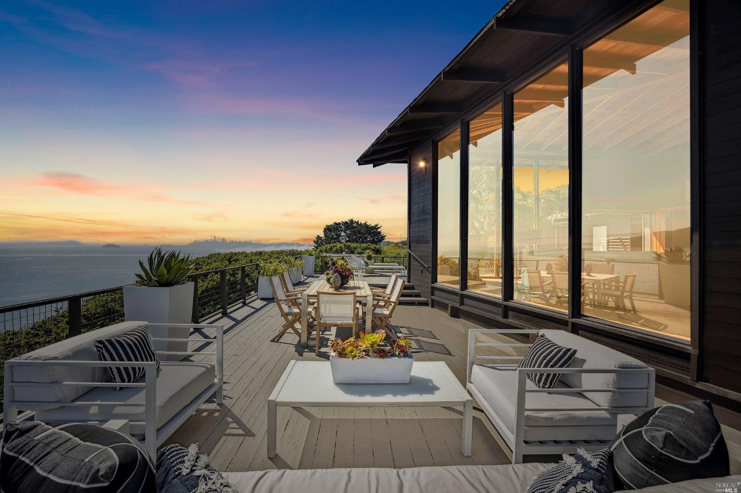 This property in Sausalito offers awe-inspiring views of San Francisco and the Bay. The home was custom-built with superior attention to detail, featuring unique and beautiful woodwork throughout the entire property. The 11' height floor-to-ceiling windows in the living room on three sides will mesmerize with completely unobstructed views of more than 180. Stay cozy with dual-zone radiant floor heating emanating from the tile floors. The main house is on two floors and is served by an interior elevator when convenience is desired. Two large wood pocket slider doors with separate screens and louvered sliders make it easy to move between indoor and outdoor spaces. And then you have the wrap-around deck, it overlooks the Bay and San Francisco and is ideal for relaxing in the sun. The swimming pool provides a refreshing escape during warm weather, while the updated kitchen awaits your creativity with its inspiring views. The main property has two bedrooms and two full baths, providing ample space to unwind. Additional space is provided with the separate legal loft studio apartment and attached deck. This home has cinema-graphic history too, as a backdrop for a film w/Angie Dickinson in 1973. Property website available for incomparable visuals and greater information.