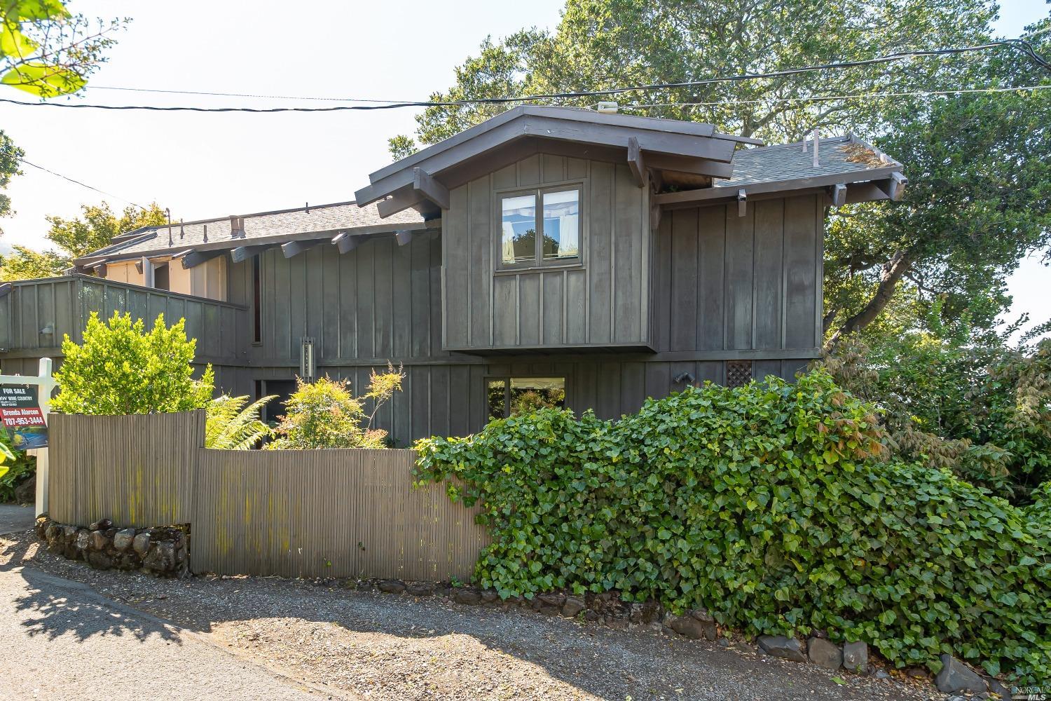 168 San Carlos Avenue A Sausalito, California First time on market in 45 years! Stuck in a 60's-time warp totally original. Sheltered down a private lane with privacy. Now you have the chance to transform this home for yourself. Living room has massive glass windows with views of the Bay and soaring wood grained ceilings complete the ambiance. Upstairs are 2 Primary suites separated by an open hallway. One Primary suite has their own roof top deck area. Perfect for a Suntan. From the deck you can see the Bay. Mature landscape and trees and views compliment this home. There is a Studio Apartment down below accessed from its own private entrance down under the home to the right with its own deck. 2 parking spaces in the garage and 1 open space in front of the home. Close distance to many shops and delicious restaurants and activities. So much to see and do here in Sausalito and yet your minutes away to The Golden Gate Bridge to San Francisco. This one is an opportunity and won't last long.