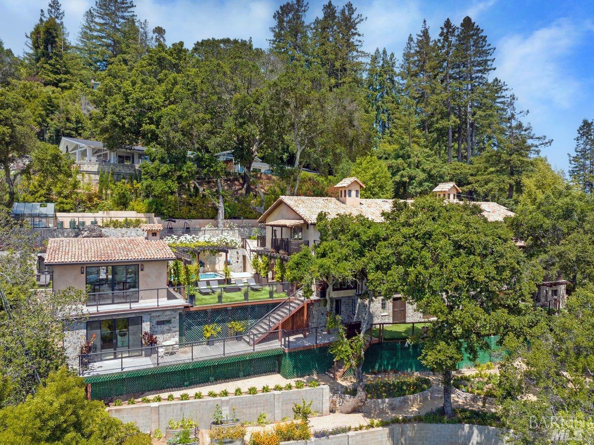 249 Hillside Avenue Kentfield, California Experience European Charm in an exquisite hidden gem nestled in Kentfield, Marin County. This artisanal estate, owned by KiVi organic skincare line, offers a harmonious sanctuary with 6 beds, 7.5 baths, and 6,135 sqft of luxury. Prepare to be captivated by panoramic views of the bay, Mount Tamalpais, Mount Diablo, and the East Bay. Meticulously remodeled, the home embodies Mediterranean villa allure, with a grand living room, gourmet kitchen, and elegant dining area maximizing the breathtaking views. The estate comprises a main house, guest house, in-law unit, and gym/pool house. The guest house and in-law unit offer comfortable accommodations, while the gym/pool house includes a jacuzzi spa and heated Endless Pool for exercise. Tranquil gardens and French doors enhance the indoor/outdoor living experience. Benefit from proximity to renowned schools, gourmet markets, and hiking/biking trails. Don't miss this unparalleled opportunity to own European allure with modern luxury in Kentfield, CA.