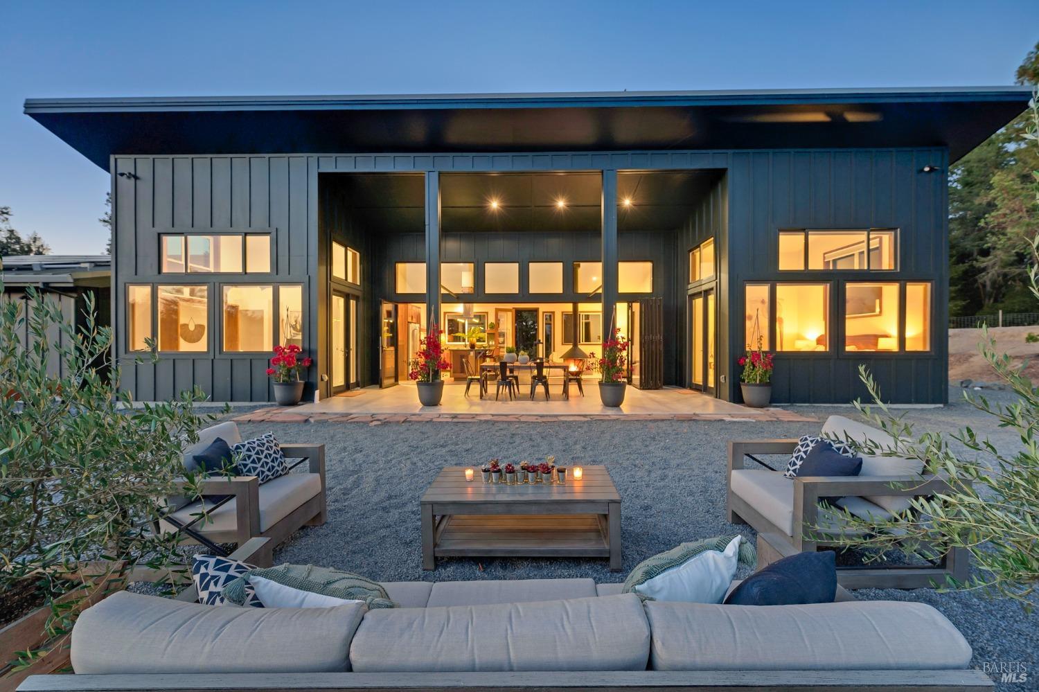 7260 Giovanetti Road Forestville, California Completed in 2022, it's impossible to capture the true essence of this unique, off-grid, custom-built sanctuary with mere words. Situated on 37+ acres, this ultra-custom masterpiece boasts 2BD and 2BA within its expansive 1,400+/- sq.ft. Tucked away down a private lane & perched atop a knoll, it offers uninterrupted views of the captivating Western Sonoma County landscape. The property exudes peace, serenity, stillness, and sheer wonder - a rare find for a retreat is approximately 2 miles from downtown Forestville. Designed with entertaining in mind, the seamless flow between indoor and outdoor space creates a sense of fluidity and abundance. The meticulous craftsmanship is evident in features like fire-resistant cement board siding, standing seam metal roof, radiant-heat polished concrete flooring, soaring ceilings, a 25' Nana Wall, a gourmet kitchen equipped with an 8-burner range, and hand-crafted Cumaru cabinetry. Reclaimed old-growth 9-foot redwood doors add to the home's character. An attached carport provides a versatile space for leisure, a workshop, or creative endeavors. Additionally, a detached look-out deck and shed can serve as a yoga studio, office, or even a cozy camping spot for warm summer nights. Properties like this are exceedingly rare and should not be missed