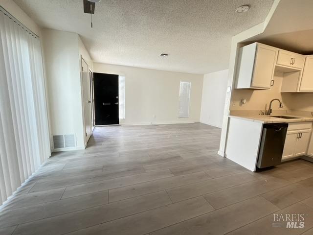Good opportunity to own this 2 beds 1 bath condo, HOA includes community pool. Newly remodeled with new kitchen cabinets, new floor, new shower room, and is move in ready.  Good location, less than 3miles from the freeway, shopping, and school. Central AC. Community pool.