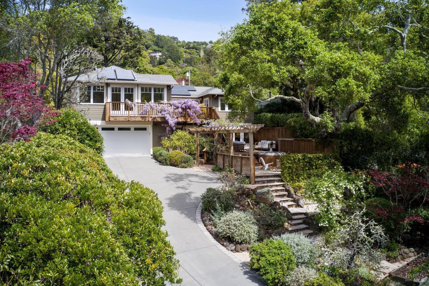 This retreat like home in the prestigious Blithedale Canyon neighborhood of Mill Valley is enveloped by flourishing gardens and just a short walk to downtown. Bathed in natural sunlight, with 5 beds, 4 baths, office and bonus room home, offering a perfect family friendly floorplan. Spacious primary + 2 additional beds on the main level and 2 beds, plus office and bonus room down. Large living room with vaulted ceilings, frplc and French doors open to the large entertaining deck, overlooking the garden and blooming wisteria beyond. Grand Chef's kitchen with granite counters, spacious center-island, s/steel appliances and high-end cabinetry. Office with abundant built-ins and bonus room, perfect for home movies, playroom, or exercise room. Separate laundry room. All bedrooms have large closets with built ins. Large storage room. Gated entrance off Portola Lane, driveway parking for 4 + cars, as well as 2 car garage and electric car charger. Large back garden with multiple sitting and lounging areas, hot-tub and flat areas for veggie gardening.