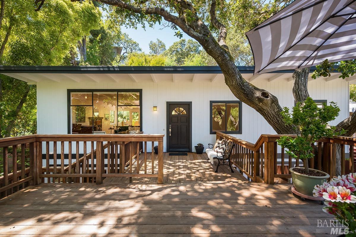 Elegant Mid-Century Modern home...you will love this enchanting Oak-studded setting.  This home show