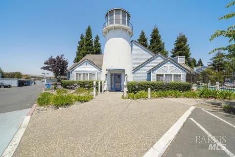 This Cape Cod-inspired condominium in a gated community and conveniently located close to Hwy 37 + I