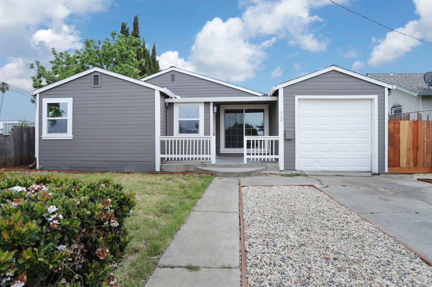 Completely remodeled 3 bed 2 bath & 1512 sqft home with a large 400 sqft garage/workshop in the back