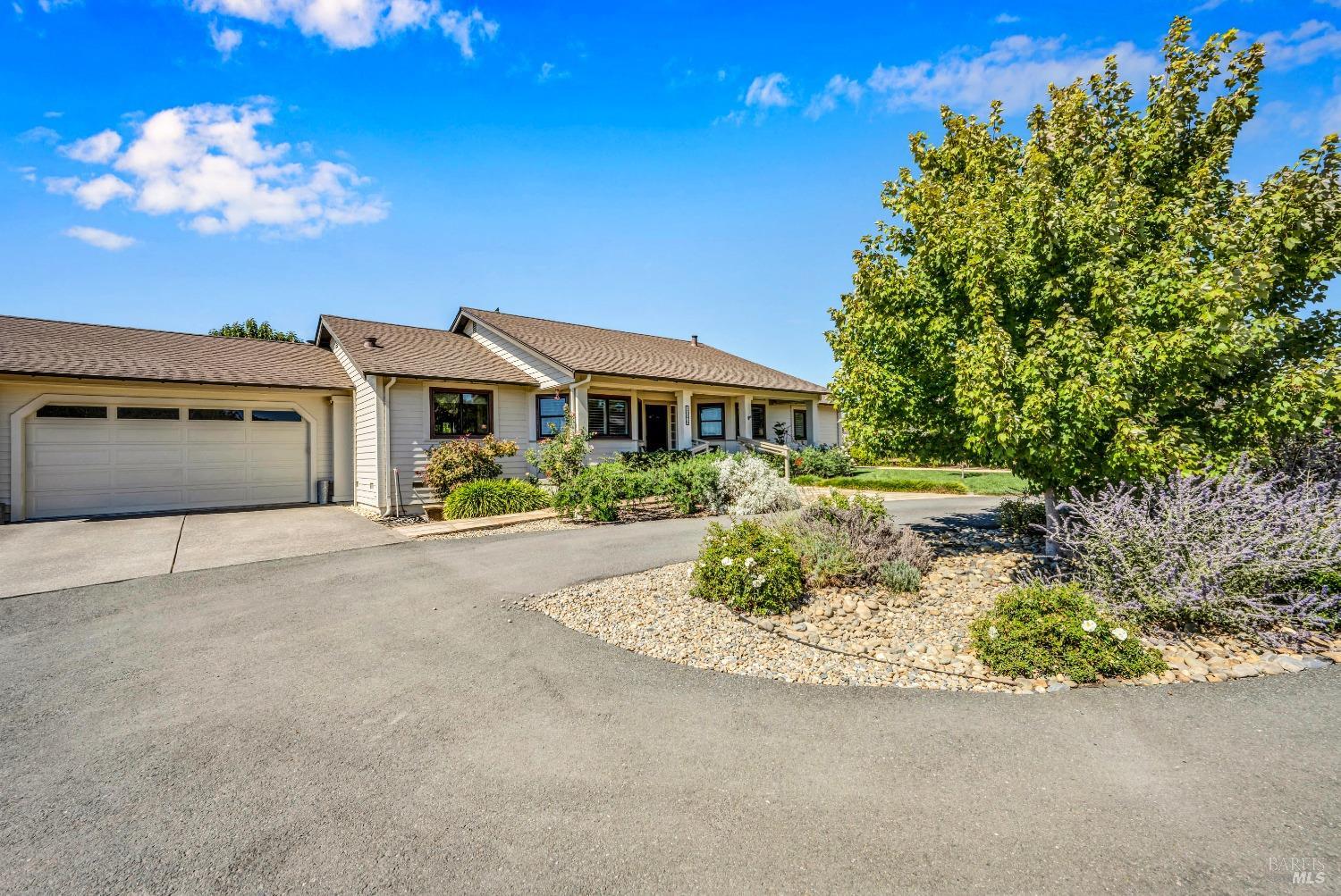 Welcome to the Russian River Valley in Healdsburg where comfort meets style on a sprawling 1.3-acre lot. This charming single-level 3 bd, 2 ba is a haven of thoughtfully designed living space. Enjoy the newer roof, doors, and windows, complemented by fresh interior paint. The heart of the home features vaulted ceilings and a double-sided wood-burning fireplace open to the living & family rooms. Perfect for cozy gatherings. Delight in a kitchen with stainless steel Miele, Viking, and LG appliances, alongside a breakfast bar, and a formal dining room with beautiful hardwood floors. The primary ensuite offers dual sinks, a soaking tub, and a separate shower. Easy indoor-outdoor living with three glass sliders off the living room, family room, and primary bedroom. Ideal for entertaining Wine Country guests. Bask in western exposure from the deck, or retreat to the landscaped outdoors with plenty of room for your backyard visions of a pool, expansive garden, or ADU. Powered by a owned solar energy system for eco-friendly living. This home truly has it all, and it is just 10 minutes to the fun and trendy Healdsburg Plaza.