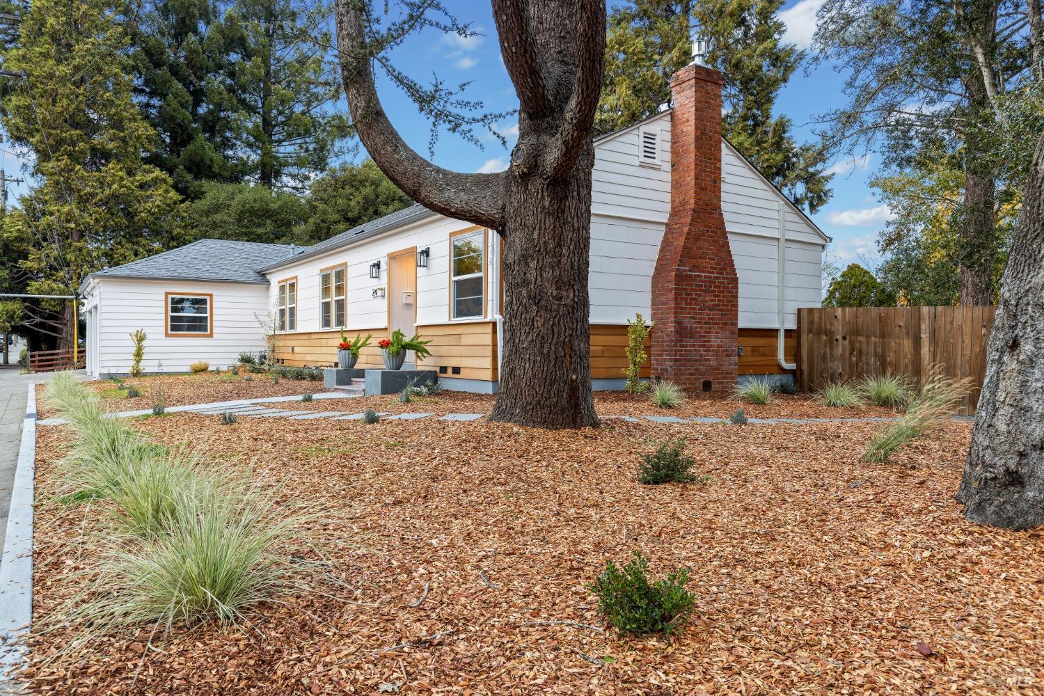 Once in a blue moon an improved property easily accessible to downtown Sebastopol comes on the market. This property has undergone a complete metamorphosis, from a forgotten overgrown original 1944 sleeper to the stunner it is today. This home has emerged into a cheerful, light & bright custom home that has honored the character of the past and embraced modern conveniences. The kitchen/dining space had a wall removed and an indoor laundry closet added. A permitted addition includes a primary suite complete with a walk in closet & a bathroom w/ a curbless shower, a marble floor & custom tile. The hall cast iron bath tub was restored and a new custom dual sink & vanity installed. All new dual paned Milgard fiberglass windows and exterior doors were installed throughout and the original interior solid wood doors were restored. New HVAC + a gas fireplace insert were installed for all season comfort.  There is a 1 car garage complete with a car charger & an additional 1/3rd garage ideal for an office space/storage. Natural wood echos throughout w/ exterior fir siding & interior red oak trim & restored red/white oak floors honoring historical detail. The best of the past & present abounds in this natural beauty ready for its new owner to cozy up to for the holidays! Welcome home:)