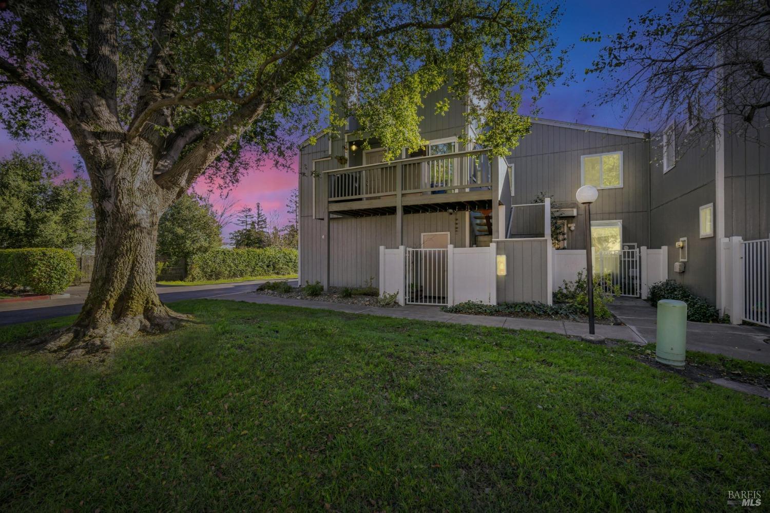 Amid a canopy of redwoods and winding walking paths lies a sanctuary of style and serenity. This upstairs end-unit town home, nestled within the intimate Ridgewood Community, radiates modernity. Bathed in natural light, its vaulted ceilings soar, while wood-look flooring throughout the whole home and a gas fireplace create an inviting atmosphere. The kitchen, a masterpiece of modern design, features open shelving, stainless steel appliances, quartz counter tops and flows effortlessly into the dining area with a breakfast bar. Every detail enchants, from freshly painted interiors/exteriors and 5'' baseboards to thoughtful updates, of open shelving storage, a Ring camera system and indoor laundry, blending beauty with peace of mind in an open floor plan suited to intimate gatherings. The community offers a solar-powered pool, clubhouse, and a basketball court, completing this idyllic retreat is a single car garage. This 2/1 town home isn't just a place to liveit's where life's most cherished moments await. Ideally, located near the renowned Green Music Center, Sonoma State University, SMART Train Depot, Graton Casino and the best of Wine Countrygolfing, hiking, and Highway 101 are all within easy reach.