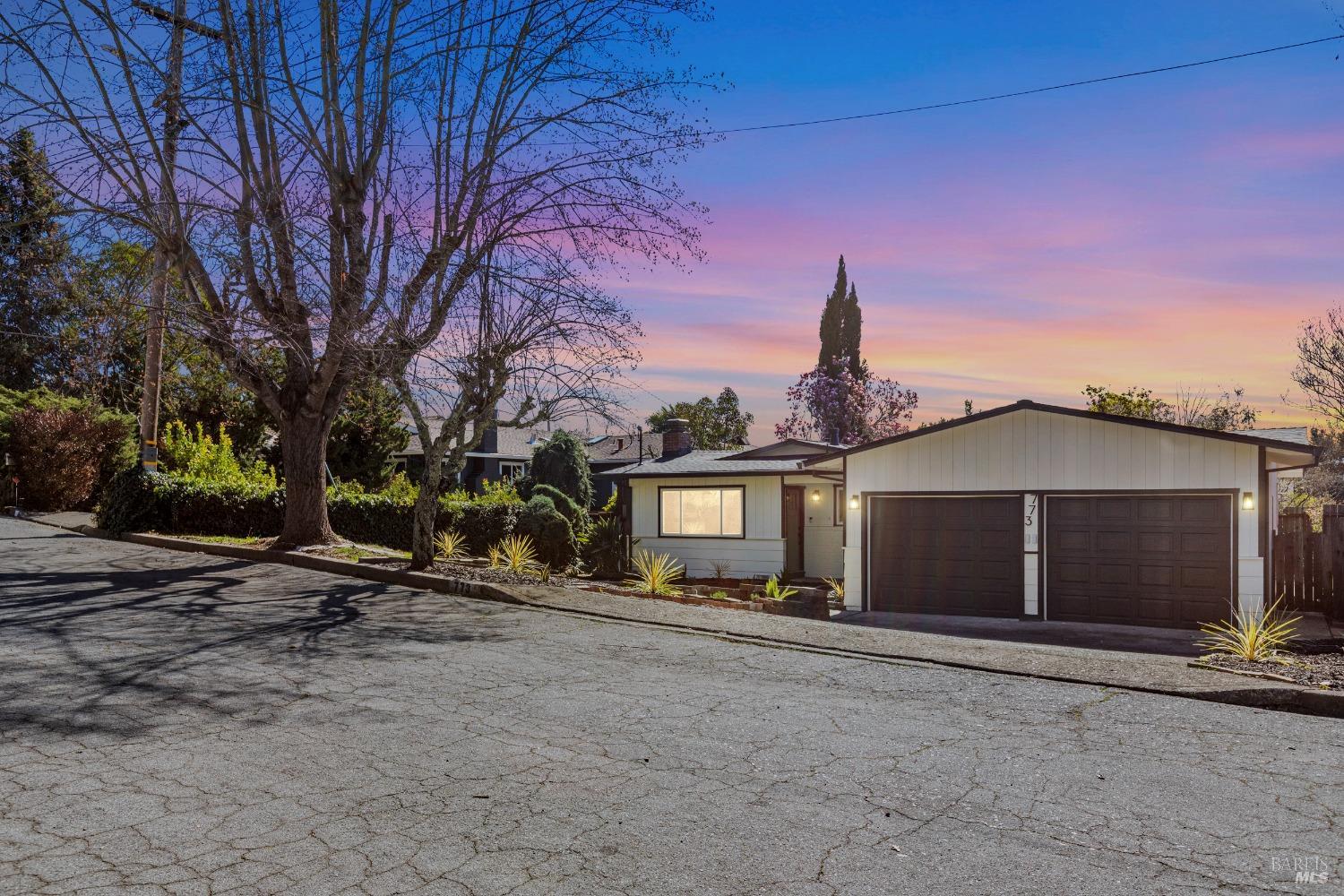 Stunning Remodeled Home in the Heart of Sonoma Wine Country! Welcome to 773 Ernest Dr, Sonoma, a beautifully remodeled home that blends modern luxury with classic wine country charm. This 3-bedroom, 2-bathroom home also features an additional office/optional 4th bedroom, offering a stylish, functional layout perfect for entertaining. Inside, you'll find a bright, open-concept living space with a cozy fireplace, creating a warm, inviting atmosphere. The gourmet kitchen is a chef's dream with quartz countertops, custom cabinetry, stainless steel appliances, and a spacious breakfast bar, ideal for preparing meals inspired by the bounty of Sonoma's vineyards and local farmers' markets. The serene primary suite is a private retreat with an en-suite bathroom, walk-in shower, dual vanity, and designer finishes. Two additional bedrooms offer ample space, and the versatile office can serve as a 4th bedroom, guest space, or creative studio. The second bathroom has been beautifully updated. Outside, enjoy seamless indoor-outdoor living with a newly landscaped backyard featuring a spacious patio, lush lawn, and mature trees. This home offers modern efficiency and peace of mind. Located just minutes from Sonoma Plaza, this move-in-ready gem provides the ultimate Wine Country lifestyle.