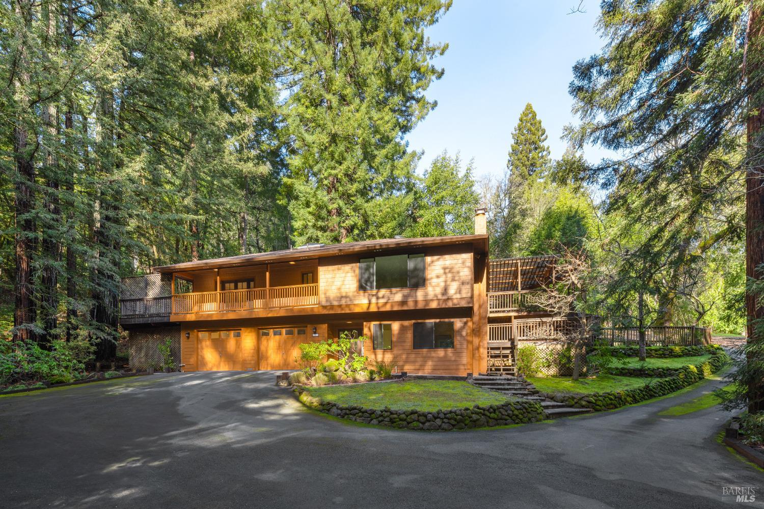 This 4-bedroom, 2-bathroom retreat offers 1,810 sf of living space on a private, fully fenced 2.48-acre lot with a seasonal creek in Forestville, CA. The home's open floorplan fills with natural light, featuring an updated kitchen with an eating nook and access to a new covered redwood deck with views of the pasture and mountains. The primary suite has French doors leading to a private deck, and the remodeled guest bath includes high-end Kohler fixtures. The lower level offers a bonus room, a bedroom, and access to a large 1,170 sf garage with new smart openers. Upgrades include new fire-rated windows, fresh paint, new carpets, a fire-rated 50-year roof, efficient boiler heat, a new water heater, and an automatic generator. Fire hardening and auxiliary buildings add safety and function. Enjoy Starlink Internet and the beauty of Redwoods, Oaks, and fruit trees. This turn-key property offers privacy, modern updates, and natural serenity!