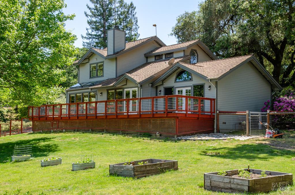 Just minutes from the charming heart of Sebastopol, this enchanting, gated property offers over 4 picturesque acres just north of the heart of Sebastopol.Surrounded by world-renowned wineries and the vibrant Barlow district, the property is a private paradise of majestic redwoods, graceful olive trees, and Heritage Oak trees. Enjoy breathtaking vineyard views and a luxurious, solar-heated pool with a stylish gazebo, ideal for casual outdoor entertaining and serene summer evenings.  For the equestrian enthusiast, a 4-stall paddock and barn make this property a dream for horses, goats and hobby farmers.  Inside, the wonderfully designed residence is bathed in natural light, with soaring ceilings, rich wood floors, and expansive glass doors creating a warm and tranquil ambiance. The spacious living room features cathedral ceilings and a cozy wood-burning fireplace, while the stunning main-level primary suite offers vaulted ceilings, skylights, and French doors which open to the scenic outdoors. This exceptional West County retreat blends refined country living with modern comfort and timeless style!