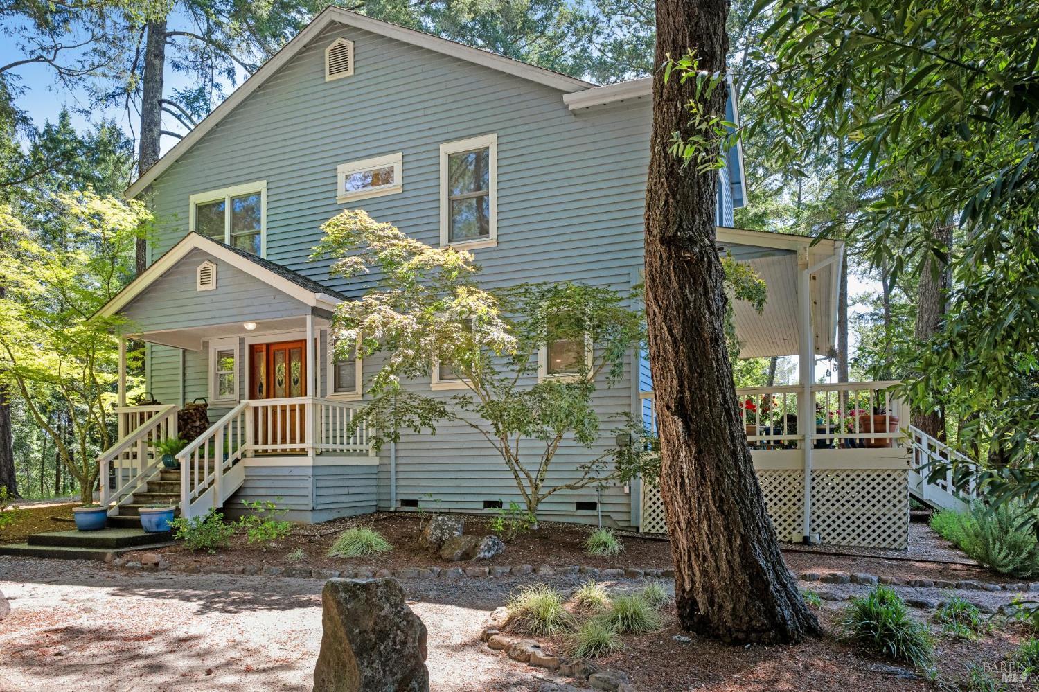 3245 W Dry Creek Road Healdsburg, California A place to make memories of a lifetime. Less than 5 miles to downtown Healdsburg you will find a beautiful slice of paradise. Sitting on a hillside in West Dry Creek lies this charming 3-bedroom 3-bath farmhouse with a sunlit country kitchen a cozy fireplace and a view from every room. Driving through the gates of Pezzi King Winery to this private 5.56-acre property you feel like you have stepped into a storybook property with a home that was built long ago but it was actually built in 1991. Move right in and enjoy the modern comforts of central heat, wood floors, spacious bedrooms, inviting gathering places and perfectly placed windows to take in the breathtaking views. Relax and or entertain by your pool perched above your own hobby vineyard. Sit outside on the spacious porch overlooking the pool and watch the birds soar and the leaves on the trees and in the vineyards change colors throughout the seasons. In addition, there is a detached garage with a spacious loft above that would make an ideal game room. The two car garage was once used to make wine from the onsite vineyard. If you are looking for that peaceful place with privacy to get away from it all this is the perfect second home or full-time residence.
