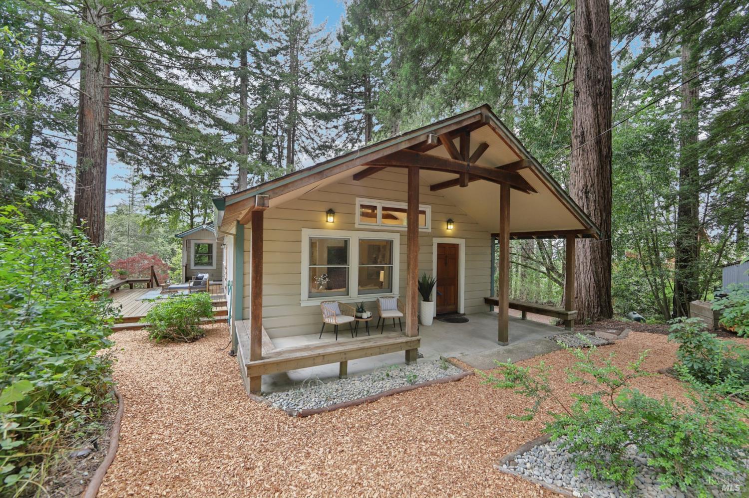 Down a quiet country lane in Sebastopol's sought-after West County, this charming 1943 farmhouse offers privacy, character, and space to create. Set on three gently sloping acres with wooded surroundings and filtered views, the home features two spacious bedrooms, a sun drenched dining room, refinished wood floors, and vaulted ceilings in the living area that invite light and openness.    A spacious workshop and a collection of detached, usable outbuildings offer flexibility for art studios, guest quarters, home offices, or garden projects. With established trees, open sky, and a peaceful setting just minutes to town, this property is a rare opportunity to enjoy the best of West County living.