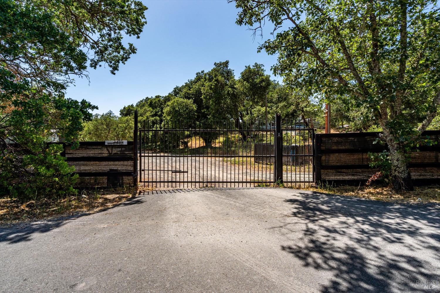 Close to Sonoma's downtown is this lovely parcel with a rural feel. A gated entry leads into 5.25+/- acres with expansive meadows, native oaks, a natural, seasonal stream and a hilltop lookout with vistas of the valley and vineyards. Land has been thoughtfully cleared to preserve specimen tress privacy and to provide large building sites. Installed electricity and 20+/- gpm well; includes a vested to 2026 3-bedroom Adobe Assoc. septic design. There is a barn for equestrian, other animals or other uses.  Off a serene country lane, this versatile parcel is apx. 1+ hour to San Francisco, apx. 20+ minutes to Napa or Petaluma. Bring your dreams and design here.