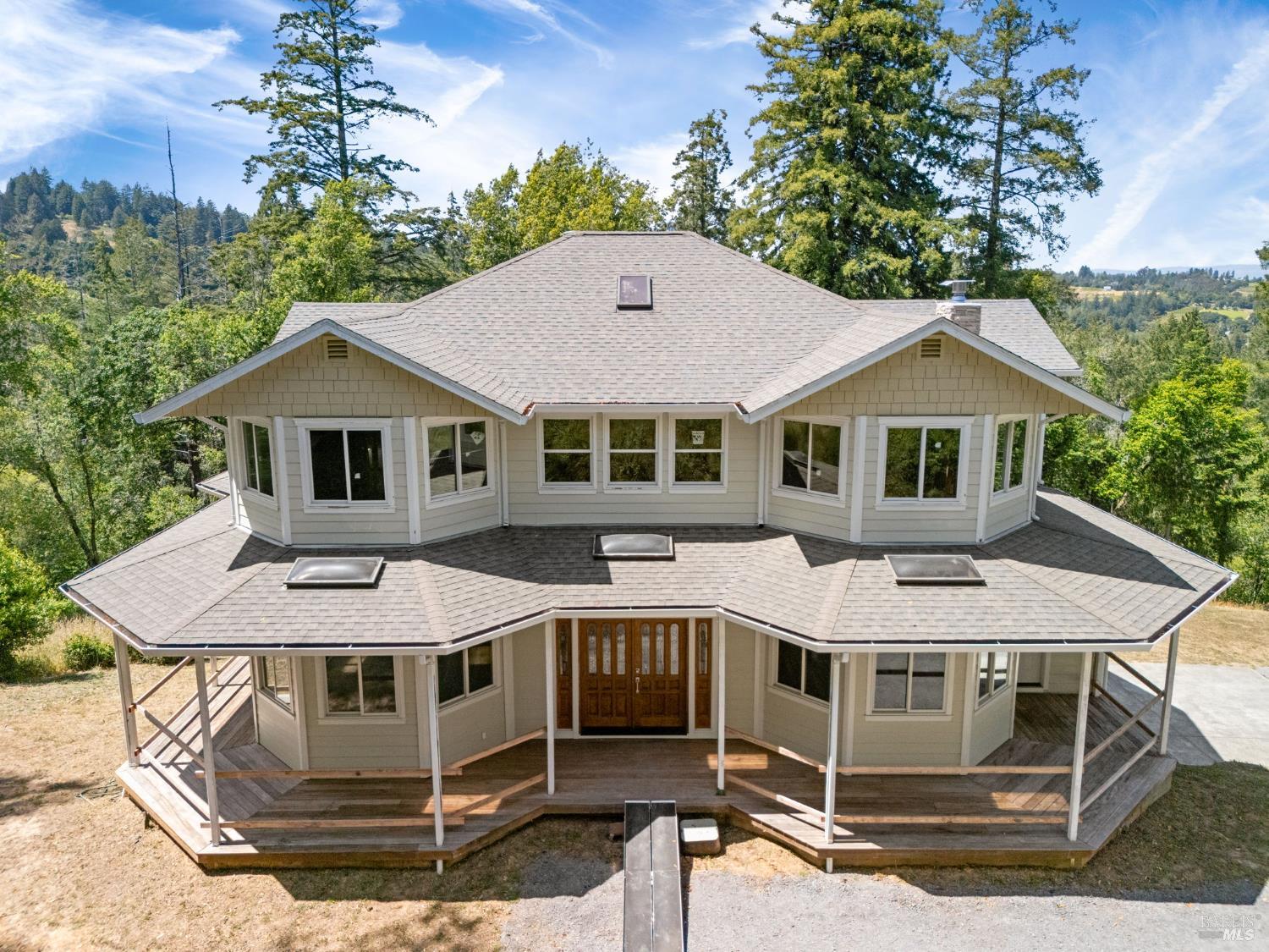 Welcome to this custom-built 4-bedroom, 3-bath home nestled on 2.9 private acres, offering a rare opportunity to create your dream retreat. The exterior is fully enclosed and plumbing and electrical systems are already in place. Bring your contractor and your vision to complete the interior exactly to your taste. The main living and dining areas open onto a spacious wrap-around deck, perfect for taking in the sweeping views. Enjoy your morning coffee on the sunporch off the family room. Upstairs, the expansive primary suite features a sitting area, office space, a walk-in closet, and a large bathroom. Three additional bedrooms provide plenty of space for family or guests, each offering tranquil views of the surrounding acreage. The attached oversized two-car garage includes an exercise room and an area ideal for a wine cellar. The home is wired for a smart home setup and includes two additional storage tanks for the well. Additionally, the property features a 2,100 sq. ft. separate shop fully equipped with a generator, three-phase converter, air compressor, car lift, and vacuum systeman excellent space for hobbies, a workshop, or car enthusiasts. Don't miss this incredible chance to customize a one-of-a-kind home in a peaceful, private setting.