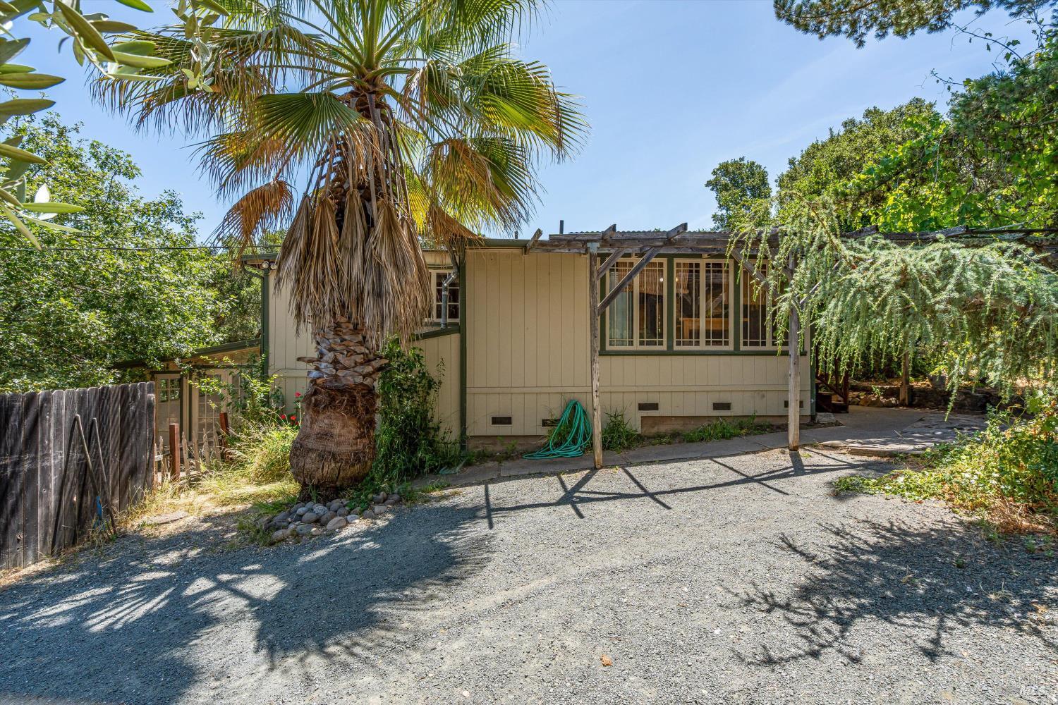 298 E Agua Caliente Road Sonoma, California Charming artist's bungalow nestled on a sprawling 1.71-acre lot in Sonoma's countryside. This cozy home features two bedrooms plus a bonus room, a spacious eat-in kitchen, and light-filled living and dining areas with large windows that invite the outdoors in. A detached studio with its own kitchen and bath offers the perfect space for guests, creative work, or potential rental income. Mature trees, open skies, and room to roam make this a rare find. Enjoy the peace of rural living with the convenience of being minutes from town. Gated entry, ample parking, and room for gardens, animals, or future expansion. Seller financing availableflexible terms for the right buyer. A unique opportunity to own a slice of Sonoma with space, character, and possibility.