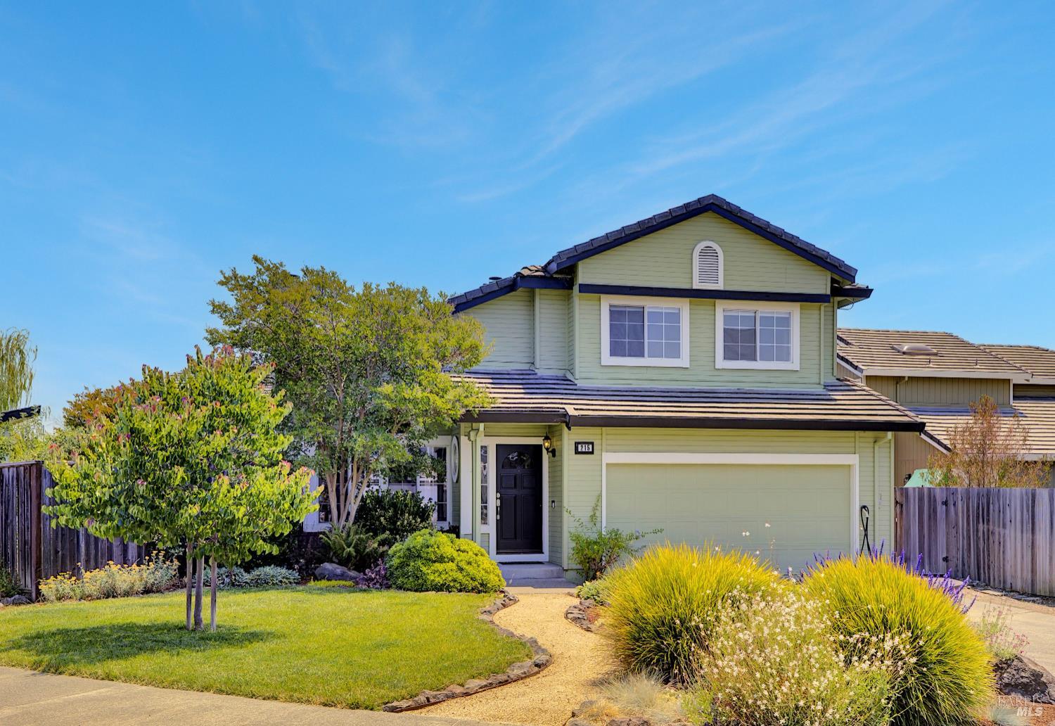 215 Flametree Circle Windsor, California Welcome to this lovely 4-bedroom, 3-bathroom home, perfectly situated on a spacious corner lot in one of Windsor's most desirable neighborhoods. This charming residence beautifully blends modern living with the tranquility of mature landscaping, and its inviting curb appeal draws you into an open and light-filled layout. As you step inside, you'll be greeted by a bright and airy living space that seamlessly flows into a well-appointed kitchen - perfect for culinary creations and family gatherings. For added convenience, a full bedroom and bathroom are located on the first floor, offering easy accessibility and privacy for guests or multi-generational living. Upstairs, three additional bedrooms provide serene spaces for rest, each filled with natural light. The backyard is a true oasis, boasting productive apple, lemon, orange, and cherry trees. You'll also find a finished shed, ideal for an office or exercise room, and a shaded pergola with a built-in gas fireplace, perfect for alfresco dining. This home is complemented by an owned solar system, air conditioning, and an EV charger. All this in a location that provides easy access to local trails, parks, schools, and shops - making it an ideal choice for comfortable and connected living.