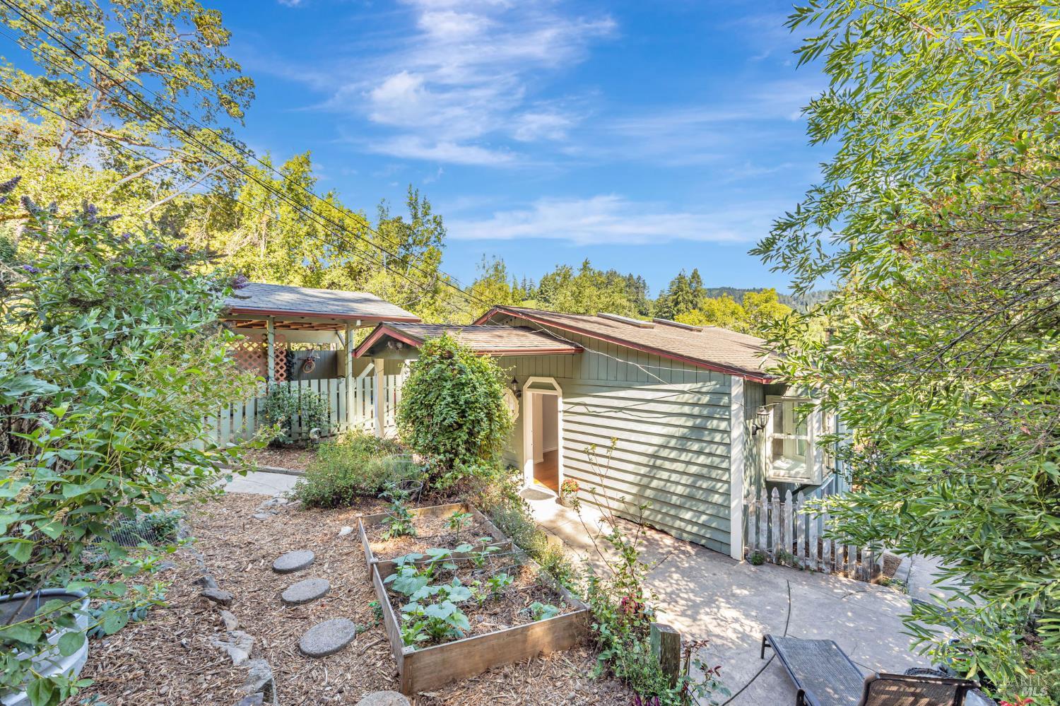 It's all about the property on this one!! Dreaming of owning land where you can bring animals, farm a garden and have room to roam? This rare find offers a home that lives like a duplex. Large lot that gently slopes down to a level back yard that borders a neighboring ranch. Enjoy the peace and beauty of West Sonoma County with gorgeous views of meadows, forest and vineyards on the distant hills. So much open sky above for sunny days and starry nights! The home and decks need work!! But both units are absolutely livable in current condition. The 2/1 upstairs offers an open floorplan with kitchen, dining and living room. One large bedroom, and a smaller room with French doors to deck. Studio downstairs with bathroom, kitchen, room to dine and door to private deck. Laundry in large basement between the two homes allows for plenty of storage space. Enjoy the established garden beds, variety of fruit trees, so many flowering plants and trees and room to harvest more. Play structure, barn, two sheds, large chicken enclosure and greenhouse all convey. Driveway at lower portion of property allows for extra parking, access on Fairwood Ave. Cultivate your dreams, don't miss this potential!