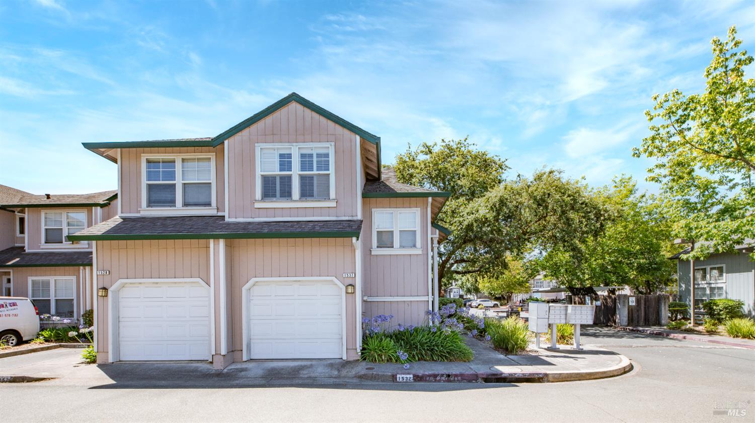 Welcome to 1532 Pinebrook Place, a well-cared-for townhome offering a bright and functional layout in a prime Santa Rosa location. The main level features vaulted ceilings and large windows that fill the space with natural light. The open living and dining areas flow to a private fenced patio, creating the perfect setting for relaxing or entertaining. Upstairs, you'll find 2 comfortable bedrooms and a full bath, with newer flooring on the main level for a fresh, modern feel. An attached garage plus one additional assigned parking space provide everyday convenience. HOA dues of $450/month include exterior maintenance, roof, trash, and exterior insurance, allowing for low-maintenance living. Ideally situated near shopping, dining, and local amenities, this home combines comfort, convenience, and a great location in a peaceful, well-kept community.