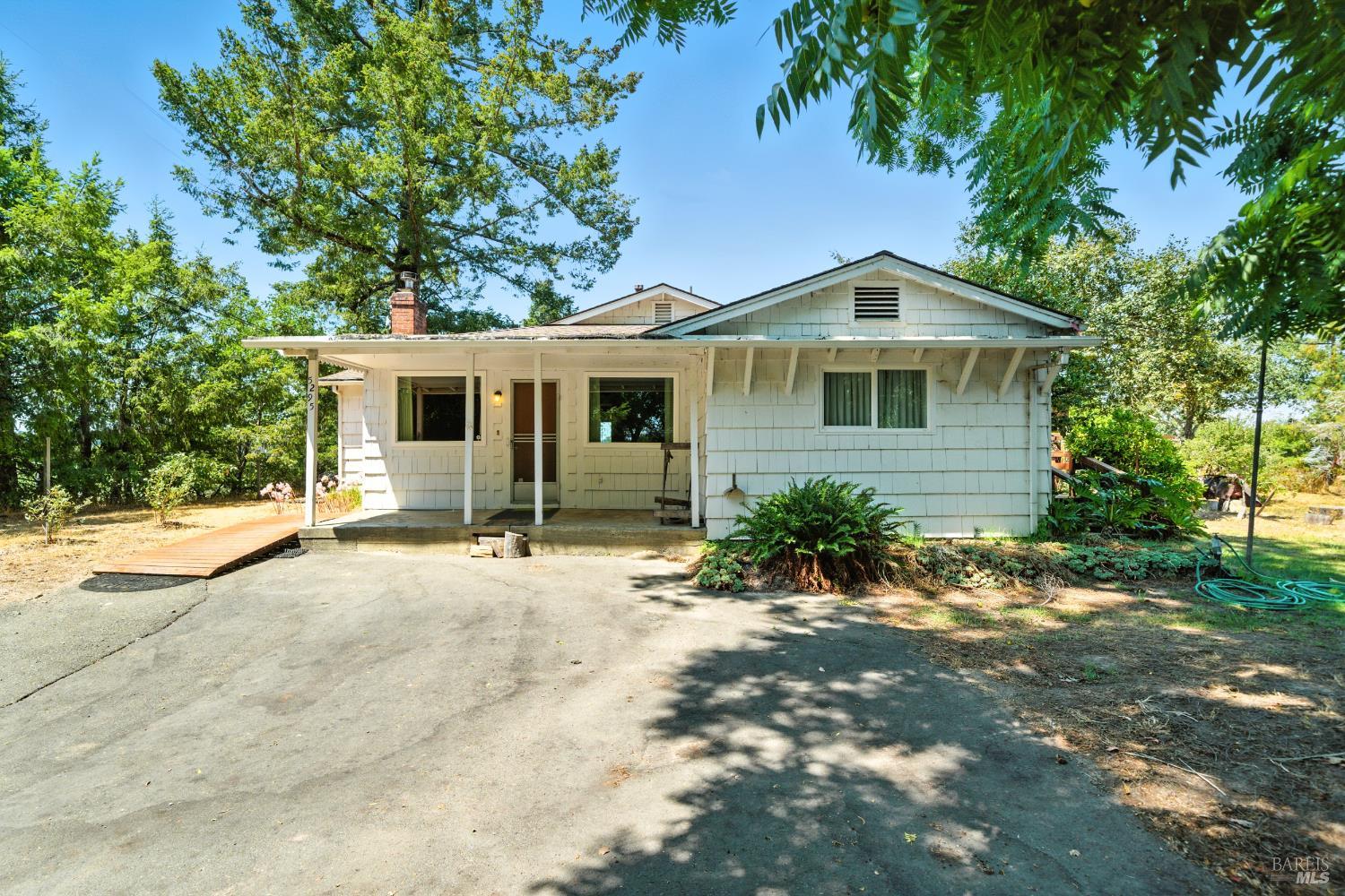 Discover the absolute essence of West Sonoma County living with this original cutie. Nestled on a spacious 2.38-acre lot, this classic 3-bedroom, 2-bath home offers over 1600 sq ft of comfortable living space in the heart of Sebastopol, complete with a detached 735 sq ft garage.   What truly sets this property apart is its established orchard with an extremely impressive variety of fruit trees, creating a lush, edible landscape that celebrates Sebastopol's agricultural heritage. Imagine harvesting your own apples, pears, and plums just steps from your kitchen, or enjoying morning coffee under the shade of mature trees.  Whether you're dreaming of a country lifestyle or seeking a tranquil weekend retreat, this property delivers timeless charm and room to grow.