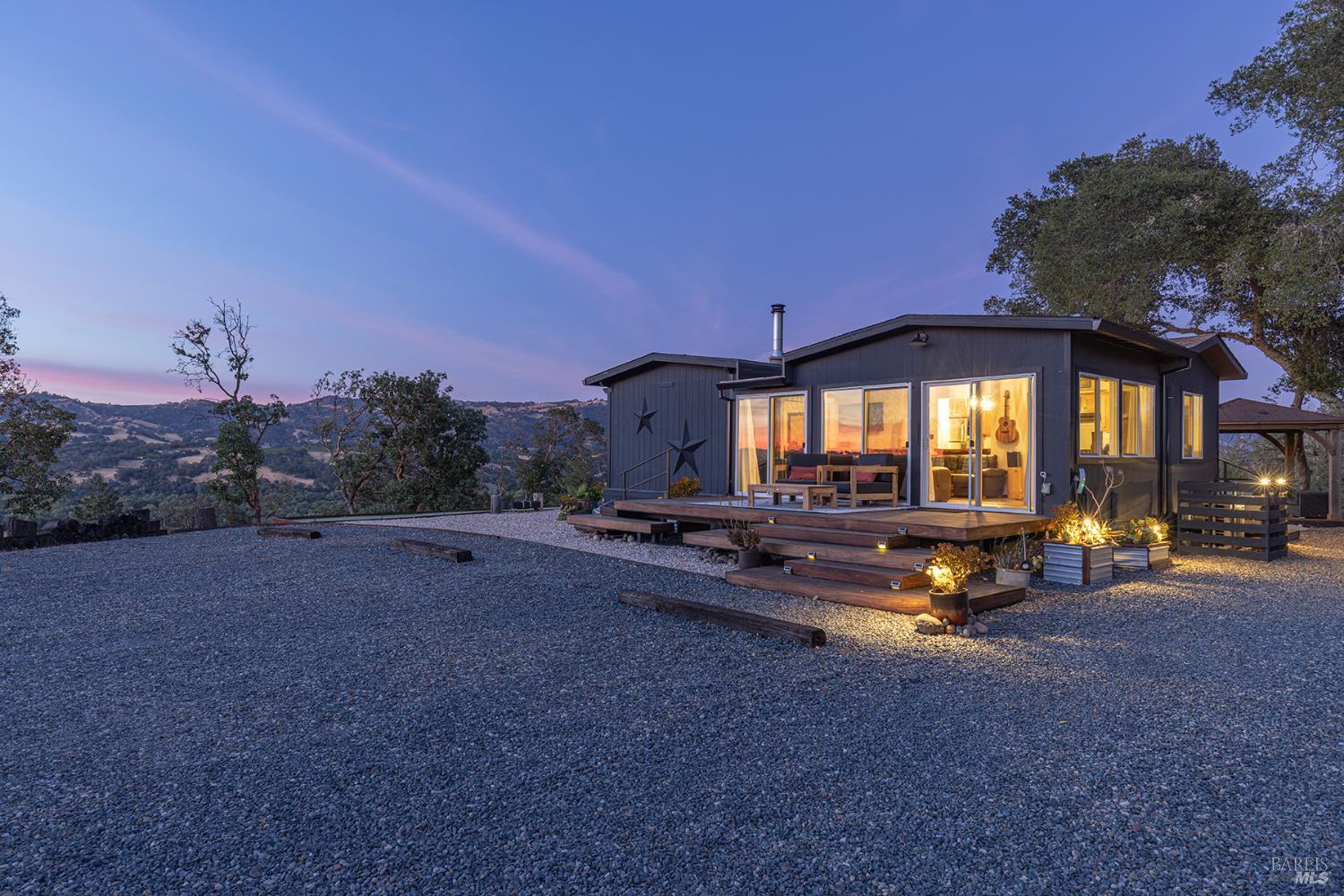 22855 Chianti Road Geyserville, California Discover the best of Wine Country living at 22855 & 22851 Chianti Road, a fully renovated estate on 16.61 acres with incredible 180 degree views of Alexander Valley. This beautiful property features a thoughtfully updated main residence, a stylish ADU, and fully renovated cabin. Located just minutes to Geyserville and Healdsburg, you'll enjoy easy access to renowned wineries, fine dining, and endless outdoor activities. Currently operating as a successful short-term vacation rental, the property offers immediate income potential or the opportunity to create your own private retreat. The main home and additional units have been tastefully renovated, blending modern comforts with rustic Wine Country charm. Expansive decks, mature landscaping, and spectacular sunsets create an inviting outdoor setting ideal for entertaining or relaxing. Whether you're seeking an investment, a family compound, or a peaceful escape, this turnkey property embodies the Sonoma County lifestyle.