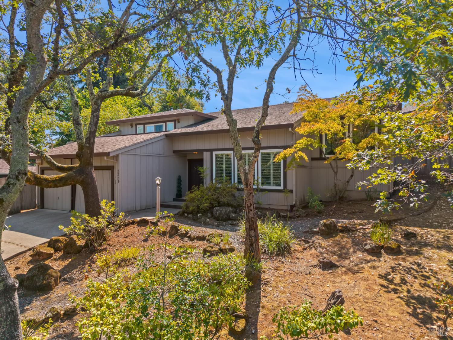 2321 Sunrise Avenue Santa Rosa, California Welcome to Proctor Heights! This multi-level home offers space, light, and versatility in one of Santa Rosa's most exclusive neighborhoods. With 3 bedrooms and 2 bathrooms, it's designed for both comfort and creativity. The expansive kitchen is ready for your culinary creations and entertaining, while the dining room overlooks the living room, filling the space with natural light. The living room features open beam vaulted ceilings and floor-to-ceiling windows that frame the natural front yard setting. The primary suite includes a private deck with views over the neighborhood, while the two guest bedrooms are connected by accordion doors, offering flexible living options, use them as two rooms or open them up into one large space. Almost 200 sq. ft. of extra off the garage is ideal for an office, workshop, studio, or even an additional private bedroom. This home combines character, functionality, and flexibility in a sought-after location.