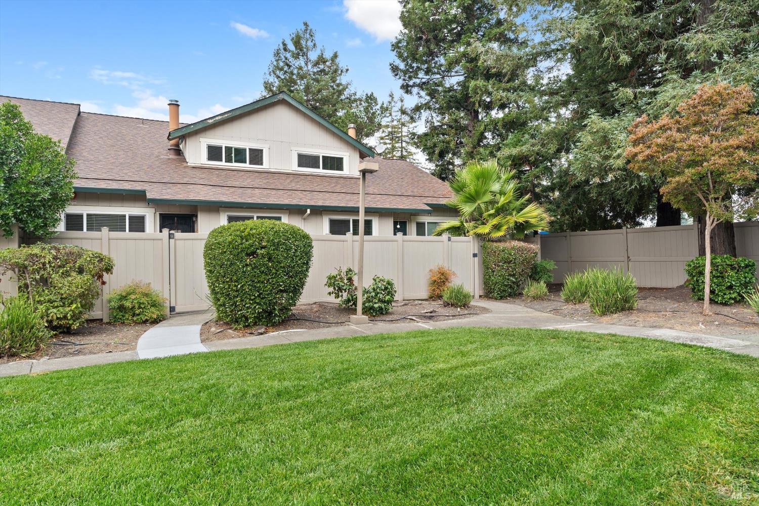 1022  Civic Center Drive  Rohnert Park, California Welcome to 1022 Civic Center Drive, a charming 2-bedroom, 1.5-bathroom condominium located in the desirable Meadow Pines Community. This two-story end unit offers a rare combination of privacy, convenience, and comfort. Enjoy the ease of an attached two-car garage and unwind in the serene front garden and patio, which opens directly to a lush greenbelt, perfect for relaxing or entertaining. Inside, the home features an open-concept layout with soaring cathedral ceilings, a cozy brick/tile fireplace, and abundant natural light throughout. Both bedrooms are privately situated upstairs, creating a peaceful retreat. The HOA dues cover roof, exterior maintenance, structure insurance, as well as water, sewer, and garbage giving you peace of mind and added value. Centrally located, this home is close to Sonoma State University, the Green Music Center, Rohnert Park SMART Train Station, golf courses, the local library, numerous parks, coffee shops, and restaurants. Don't miss this opportunity to live in a beautifully cared-for home in a prime location!