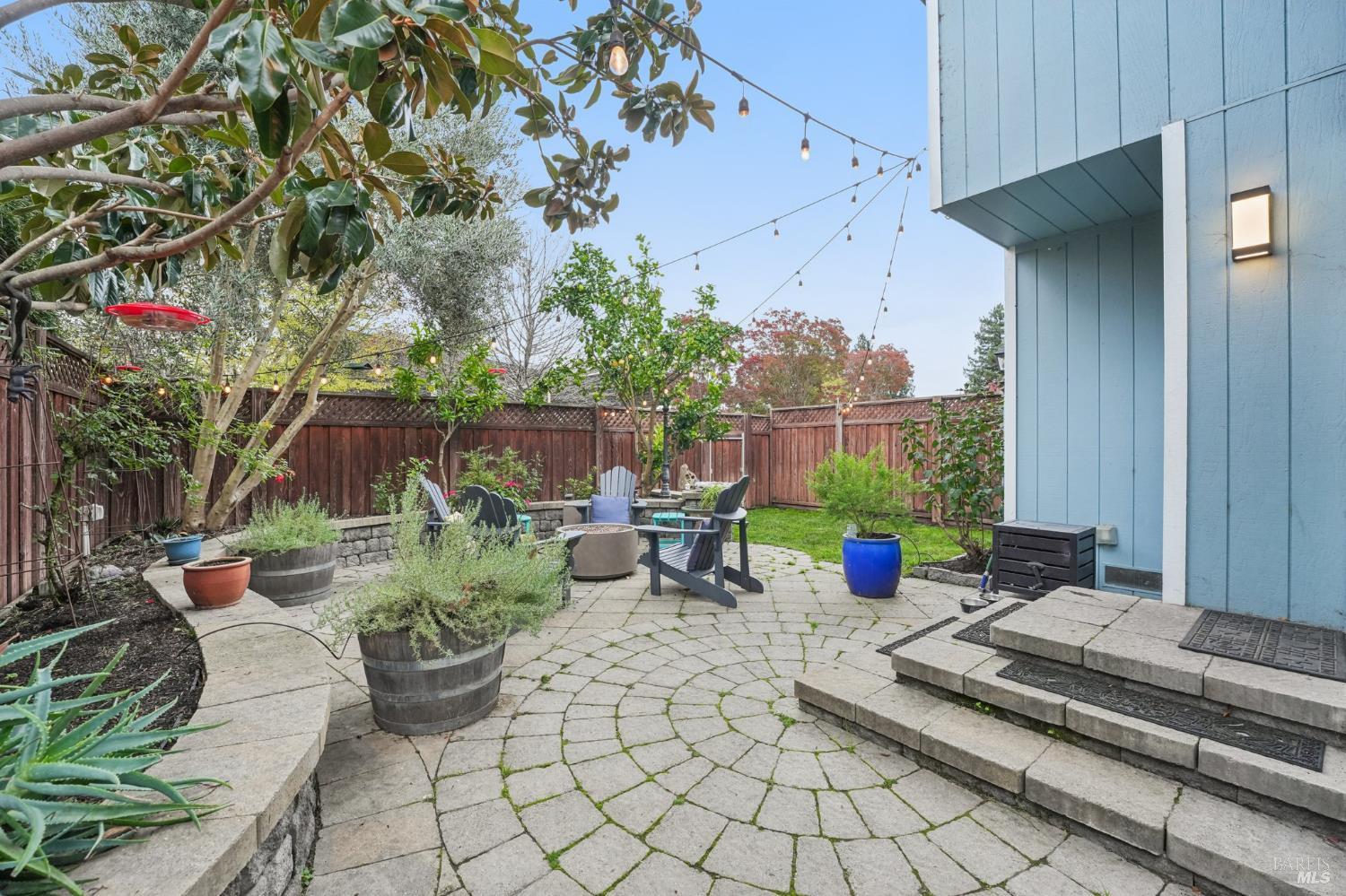 Adorable end-unit townhouse in the heart of Rohnert Park. This loved and tastefully remodeled 3BD/2.5BA home offers a cozy, bohemian-inspired interior with inviting living spaces and a flowing floorplan for easy living. A double-sided fireplace warms both the living and dining rooms, and the updated kitchen features a seating bar, stainless steel appliances, and a pantry closet. All bedrooms are conveniently located upstairs, including a spacious primary suite with a vaulted ceiling. Enjoy a charming backyard with pavers, a lawn area, planters, and fruit trees. The rear of the home opens to a small greenbelt and SSU land with access to open fields. The HOA offers a community swimming pool. Ideally located near Rainbow Park, Copeland Creek Trail, schools, shopping, and with easy access to Hwy 101 and Petaluma Hill Rd. A rare offering in this community, homes like this seldom come to market.